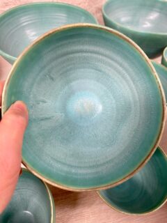 My latest strontium matt glaze batch ran and stuck all the pots to the kiln shelf. There are some interesting crystals on the outside where the glaze was applied more thinly. I need to adjust this turquoise glaze to make it more stable, both physically less runny and chemically more durable. First I will remove the lithium carbonate, substitute it with borax frit, add some kaolin, then I might try adding whiting or zinc oxide. 
These changes will all make it a less bright turquoise.

The recipe came from Emmanuel Cooper and is in my glaze book, Special Effect Glazes.