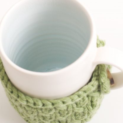 handmade porcelain- mug- tea- blue- green- knitted cosy- ruth cross- mug cosy