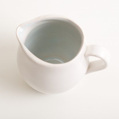 stoneware range- cafe tableware- blue interior- jug- flowers- water jug - designed by linda bloomfield