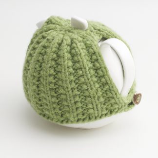 Bone China Teapot designed by Linda Bloomfield, with green knitted cosy by Ruth Cross
