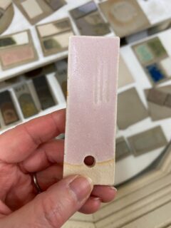 Interesting variations of this calcium matt pink glaze using various different materials and kilns in London, Belgium and Devon. Even in my own studio the last batch came out matt and the current batch came out glossy.

This is a calcium matt that’s on the border between a glossy and matt glaze (around 5.35 silica to alumina). To push it back towards matt, it only needs the addition of 5% kaolin.

Calcium matt glazes have tiny crystals covering the surface. If applied thickly, they can melt to form glossy areas. 

The pink colour comes from small amounts of chromium combined with tin oxide, rutile or titanium dioxide, known as chrome-tin pink. The glossy part of the glaze can be green, coloured by the chromium oxide, and the matt part is pink from the tiny crystals covering the surface. 

This is a matt glaze containing whiting and dolomite, rutile and tin oxide, fired to cone 8 or 9.