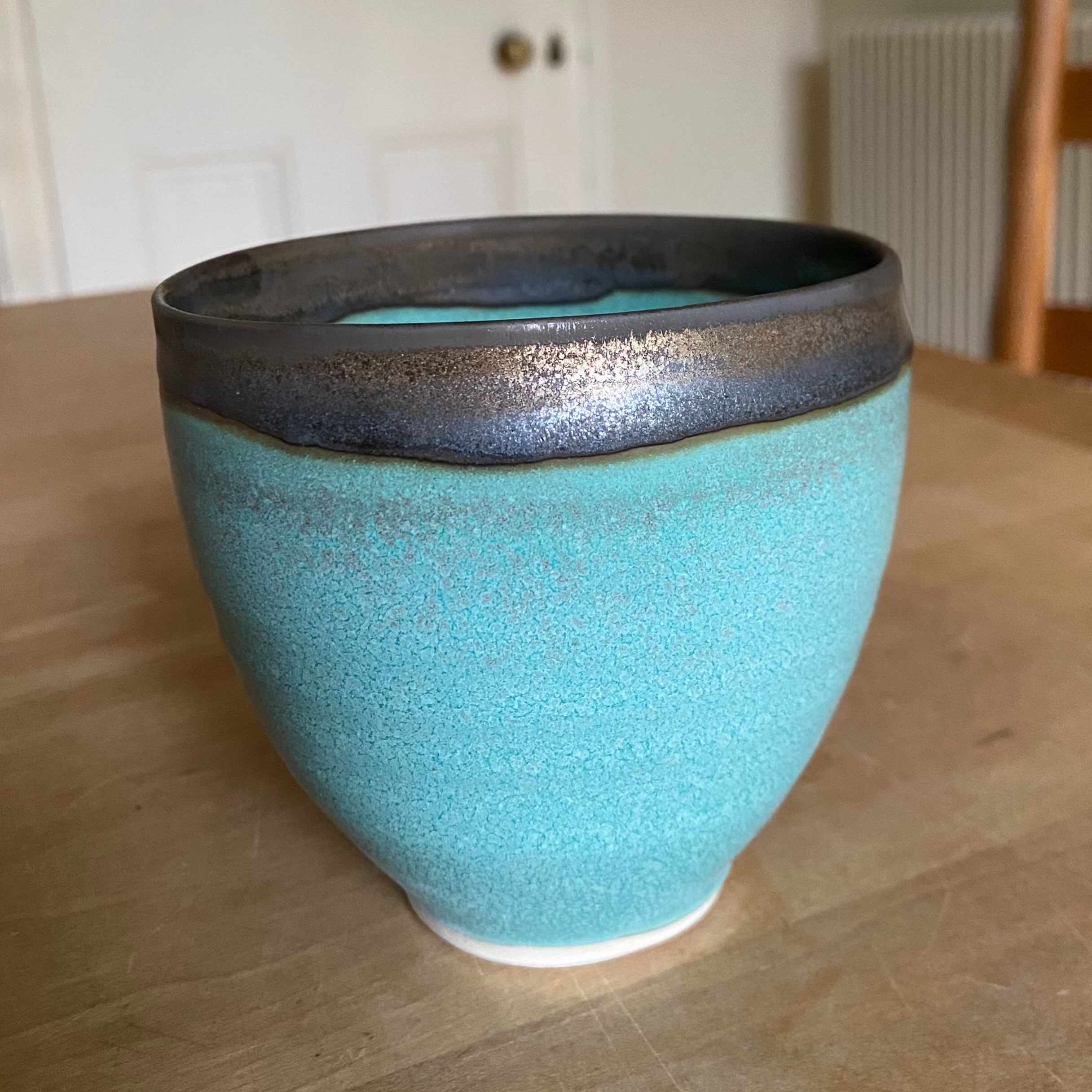 Turquoise bowl with bronze rim. This is a less runny bronze glaze containing more clay. I am trying out several different recipes from my book Special Effect Glazes, fired to cone 8 in an electric kiln.