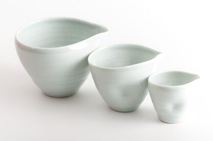wood-fired porcelain set of dimpled nesting pouring bowls