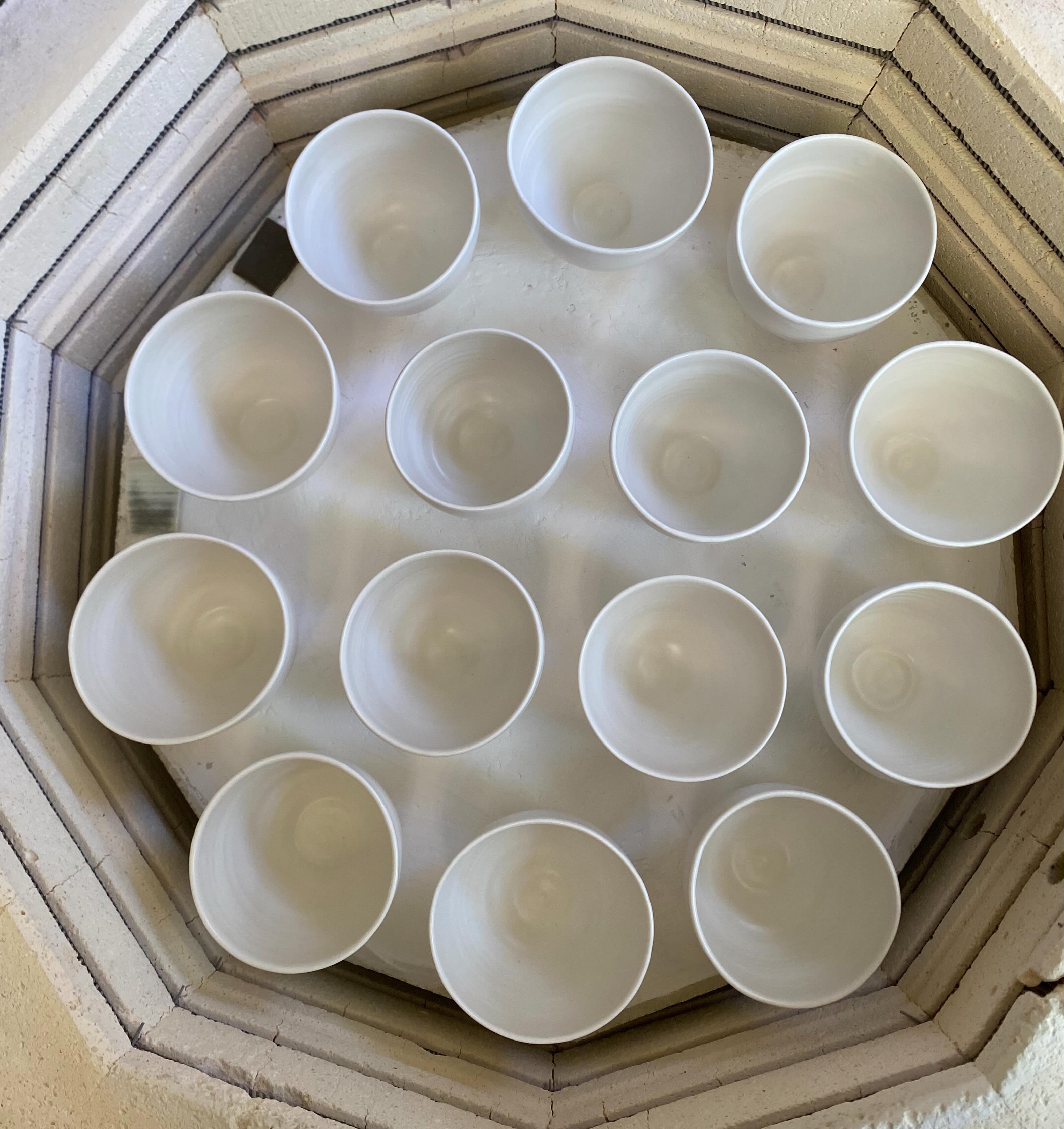 Cone 8. Almost everywhere I’ve taught glaze workshops, studios around the UK, Europe and Australia have fired to around 1250°C or cone 8. 

Why? There is a good reason for this: the clay becomes vitrified at that temperature. For example, I use Royale porcelain from @valentineclays which is vitrified at cone 8 and starts to warp at cone 10.

At cone 6, 1220°C, most clays are not vitrified and remain porous. Water can carry bacteria into the pores and mould can grow in the clay underneath the glaze. Cone 6 is not a good choice unless your clay body is specifically made to vitrify at that temperature, which is difficult without the addition of an extra flux or frit. Vitrification happens when the pores in the stoneware clay become filled with molten glass during firing. The clay becomes strong, hardwearing and impervious to water.

So I think cone 8 is a better choice than cone 6, particularly for the clay I use. Check with the clay manufacturer what is the optimum firing temperature for your clay.