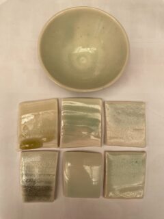 These are some of my electric kiln ash glazes and celadons, with the addition of 0.2-0.3% silicon carbide 1200 mesh and 1% tin oxide.

The silicon carbide reduces the iron oxide in the glaze from Fe3+ to Fe2+, changing the colour from yellow to blue-green. The tin oxide oxidises any remaining silicon carbide, changing it from black to colourless silica plus carbon dioxide gas.

The glaze needs to be fluid so that the gas can escape, otherwise you may end up with a lava glaze. Soaking at top temperature helps.